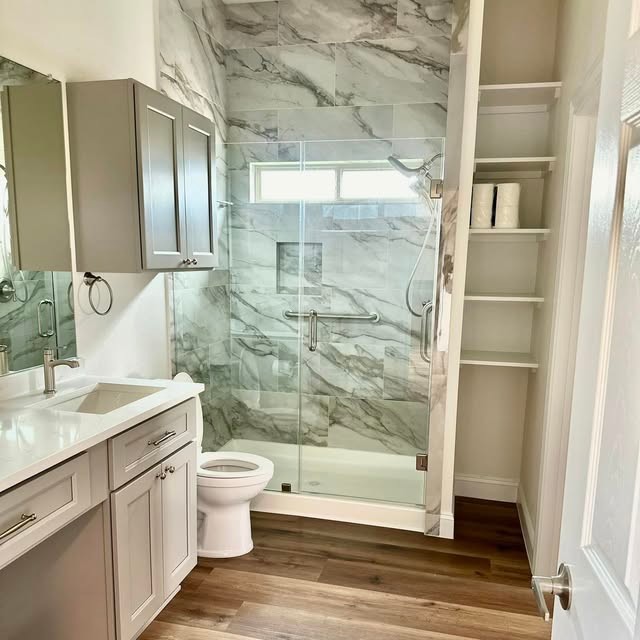 Bathroom with glass shower and floating vanity