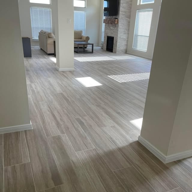 Wide-plank wood flooring in an open living room