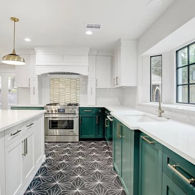 Kitchen remodel with emerald cabinets, white quartz waterfall island and patterned tile floor by Gudino & Sons