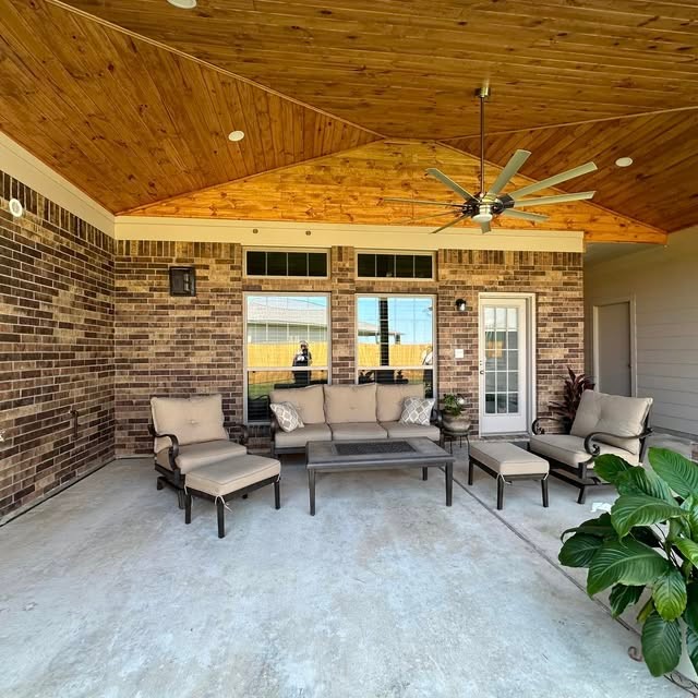 Covered patio with stained wood barrel ceiling